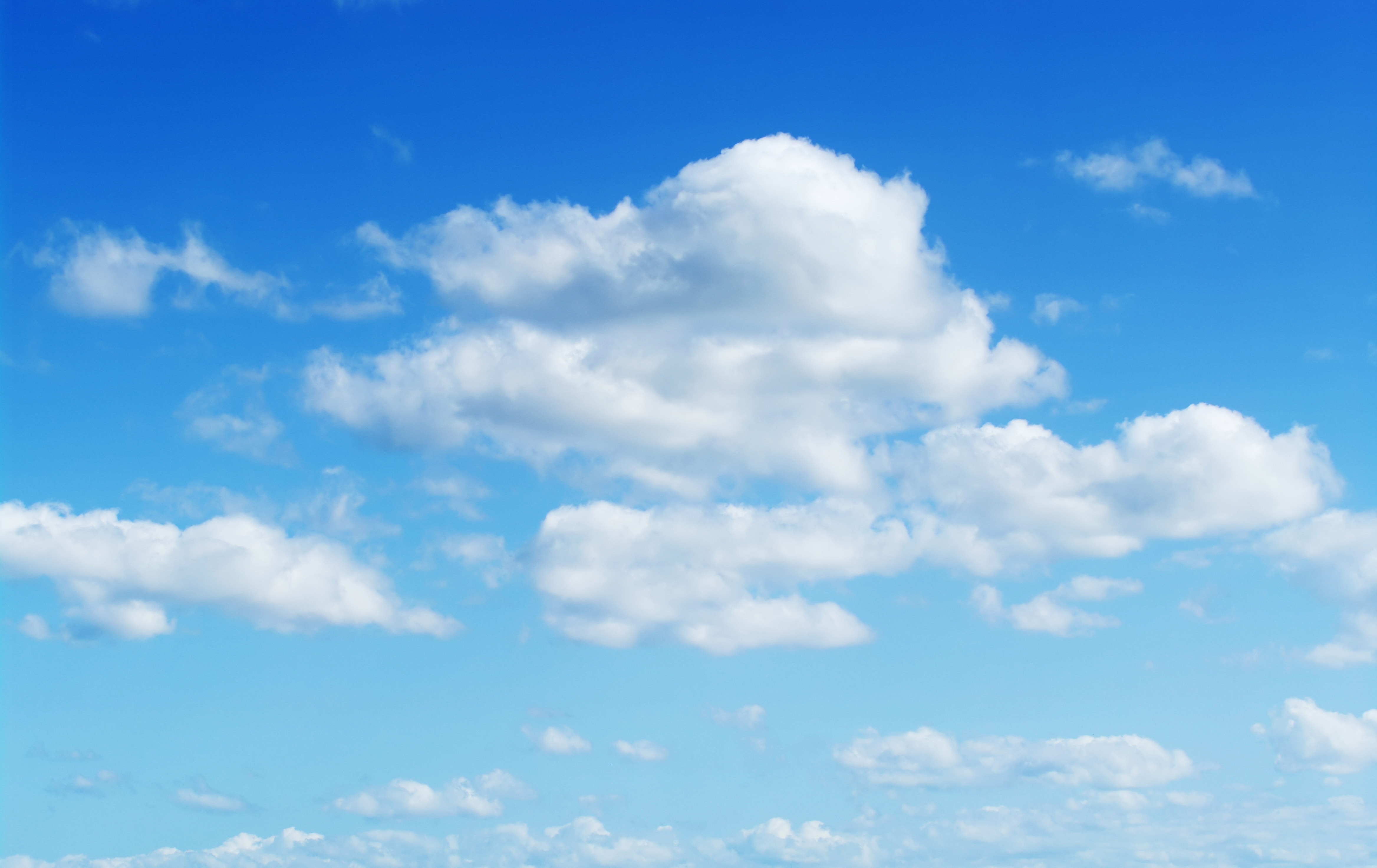Fluffy White Clouds In A Blue Sky by Emrah Turudu